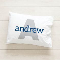 a white pillow with the word andrew on it