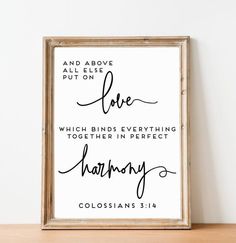 a framed print with the words, and above it is love which birds everything together in perfect harmony colossians 514