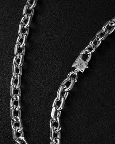 Cast and tethered by a forge, bearing links to charm all. Wear this sleek, versatile cable chain necklace on its own or imbue it with your essence by adorning it with your favourite charms from The Charm Lab series. Each link in the Catalyst Chain Necklace is meticulously carved with chiselled edges, embodying a versatile, genderless appeal.
Complete your look with other jewelry from the Catalyst series.
Sold individually. Each piece is lovingly crafted by hand, under ethical working conditions. Luxury Everyday Cable Chain Link Necklaces, White Gold Metal Cable Chain Necklace, White Gold Metal Chain Necklace With Cable Chain, White Gold Link Necklace With Solid Construction, Everyday White Gold Link Chain Necklace, Luxury Silver Link Chain Necklace, Stainless Steel Necklaces With Oval Rolo Chain, Luxury Metal Cable Chain Necklace, Luxury Silver Cable Chain Necklace