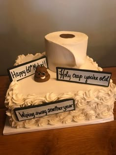 a birthday cake with toilet paper on top