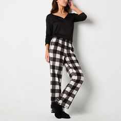 These women's plaid pajama pants by Sleep Chic are perfect to mix in to your sleepwear rotation during the colder months. Made from soft fleece, this pair includes an elastic waist, side slip pockets and comes complete with a pair of matching socks. Included: 1 Pair(s) of SocksClosure Type: Full ElasticPockets: 2 Side Slip PocketsApparel Length: 41.3 InchesFiber Content: 100% PolyesterFabric Description: FleeceInseam: 31 InCare: Machine Wash, Tumble DryCountry of Origin: Imported Plaid Sleepwear Pants For Pajama Party, Cheap Plaid Sleepwear For Loungewear, Black Plaid Pajama Pants, Womens Buffalo Plaid Pajamas, Womens Plaid Pj Pants, Fleece Pajama Pants, Plaid Pajama Pants, Matching Socks, Elastic Waist