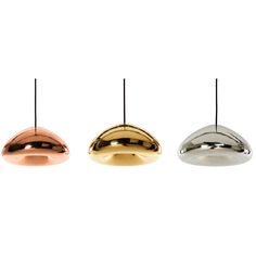 three different colored lights are hanging from the same ceiling fixture, one in gold, one in silver and one in bronze