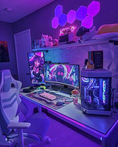 a computer desk with two monitors, keyboard and mouse on it in a purple room