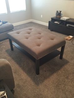 a living room with two couches and a coffee table in the middle of it