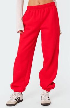 Love to lounge in these slouchy sweatpants crafted from a soft cotton blend with handy side pockets. Elastic waist Side-seam pockets Elastic cuffs 50% cotton, 50% polyester Machine wash, dry flat Imported Red Sporty Pants For Loungewear, Trendy Leisure Sweatpants With Elastic Cuffs, Trendy Relaxed Fit Sweatpants With Elastic Cuffs, Red Cotton Bottoms For Streetwear, Trendy Sweatpants With Elastic Cuffs For Leisure, Oversized Casual Sweatpants With Elastic Cuffs, Baggy Cotton Joggers For Lounging, Baggy Joggers With Pockets For Lounging, Red Loungewear Pants For Fall