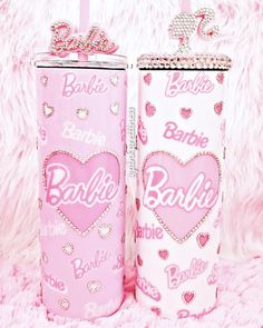 two pink tumbles with hearts and the words barbie on them