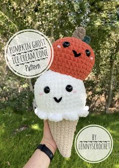 two crocheted ice cream cones with faces on them, one is orange and the other is white