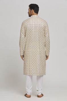 Ivory and golden cotton kurta with sequins and thread embroidery. Comes with churidar. - Aza Fashions Gold Straight Kurta For Reception, Gold Sherwani With Mirror Work For Diwali, Festive Gold Sherwani With Gota Work, Festive Gold Embroidered Fabric, Semi-stitched Kurta With Gold Embroidery For Festivals, Unstitched Churidar With Gold Embroidery For Diwali, Eid Reception Kurta With Zari Work, Eid Gold Kurta With Resham Embroidery, Festive Gold Embroidered Sherwani For Diwali