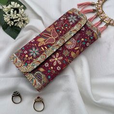 This Boho wallet is meticulously handcrafted using brocade fabric adorned with patterns reminiscent of traditional Turkish motifs, complemented by accents of vegan leather. Its allure and elegance are a testament to the classic Turkish design inspirations that grace both its front and back panels. Designed and meticulously crafted in Turkey, these wallets pay homage to the country's rich cultural heritage. Turkey is globally acclaimed for its vibrant history, stunning landscapes, and cultural diversity. Beyond its natural marvels, Turkey is celebrated for its artistry, captivating traditions, and masterful craftsmanship rooted in Turkish motifs. The intricate designs of our wallets draw inspiration from these time-honored artistic traditions. For those in search of a wallet or purse that e Multicolor Festival Clutch Gift, Handmade Multicolor Pouch Wallet, Handmade Red Clutch Wallet, Handmade Red Pouch Wallets, Multicolor Clutch With Handwork, Traditional Pink Clutch As Gift, Traditional Pink Clutch As A Gift, Traditional Multicolor Clutch As A Gift, Traditional Multicolor Clutch For Gift