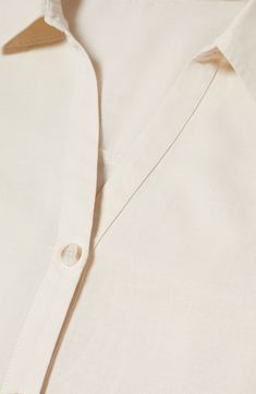 A boxy fit adds to the airy charm of this cotton-and-linen shirt framed by short sleeves and topped by a collared V-neckline. V-neck with spread collar Short sleeves 87% cotton, 13% linen Machine wash, line dry Imported Spread Collar Blouse For Summer, Summer Everyday Blouse With Spread Collar, Everyday Summer Blouse With Spread Collar, V-neck Cotton Shirt For Work, Everyday Summer Blouse With Collared Neckline, Collared Linen Blouse For Work, Collared Linen Blouse For Daywear, Linen Workwear Blouse With Collar, Linen Blouse With Collar For Workwear