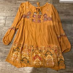 Free People Mustard Color Dress. Really Pretty Embroidery And Partially Open Back (See Picture). Bottom Is A Little Longer In The Back. Never Been Worn. Brand New! Mustard Bohemian Flowy Dress, Free People Feeling Groovy Dress, Orange Bohemian V-neck Boho Dress, Mustard V-neck Bohemian Dress, Bohemian Orange V-neck Sundress, Mustard Colored Dress, Free People Slip Dress, Bohemian Mini Dress, Free People Mini Dress