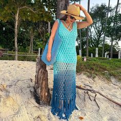 An Eclectic Hand Knitted Cotton Crotchet Coverup Crafted With Uplifting Ombre Shades Of Aqua. This Vibrant Style Is An Easy Wear, Making It The Perfect Choice To Transport You From The Coast To A Beachside Cafe With Ease. Total Length: 55 Fits True To Size Model Is Wearing A Size Small Midi/Maxi Dress Bodycon Fit Racerback Hand Knitted 100% Cotton, Lining 100% Polyester Dry Clean Only Long Crochet Knit Dress For Summer, Long Knit Crochet Dress For Summer, Knit Crochet Dress For Beach Cover-up, Bohemian Crochet Maxi Dress, Blue V-neck Crochet Dress For Vacation, Casual Blue Crochet Dress For The Beach, Blue Knit Dress For Beach, Blue Crochet Summer Dress For Beach Season, Blue Summer Crochet Dress For Beach Season