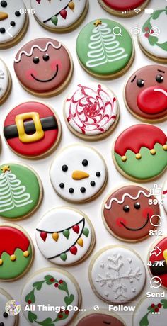 many decorated cookies are displayed on a table