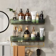 the bathroom is decorated with green shelves and gold accents, along with various personal care products