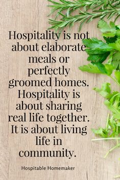 a wooden table topped with green leaves and a quote from the book, hospital is not about elaborate meals or perfectly grounded homes