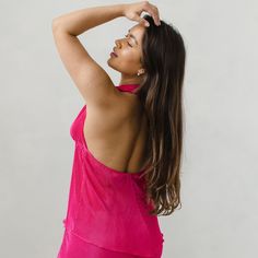 Theres nothing more chic than a halter neckline. Our plisse top ties at the front using satin rope for an adjustable fit to leave it up to your preference to show as much or as little skin as you want.  A season-less go-to top to wear to any occasion.  Look great whilst feeling your best! Each top is made custom in our London studio to fit you. Follow our size guide to find the perfect fit.  Our matching plisse trousers make this a chic coord for any occasion. Hand-wash only; DO NOT tumble dry, DO NOT iron.  Made from lightweight jersey satin plisse.  Satin plisse is a wrinkle free fabric which makes it perfect for your holiday suitcase and a timeless classic to always have in your wardrobe. Feminine Halter Neck Top For Vacation, Spring Date Night Halter Top With Built-in Bra, Feminine Halter Neck Top For The Beach, Vacation Stretch Halter Camisole Top, Chic Halter Neck Camisole For Beach, Stretch Halter Camisole For Vacation, Chic Halter Neck Camisole For Vacation, Pink Sleeveless Halter Top For Date Night, Perfect Legs