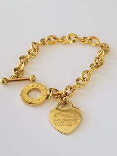 This 18k Gold Plated Stainless Steel Charm Bracelet is Tarnish Free, Hypoallergenic and Water Resistant. Made to last a lifetime. We curated this beautiful bracelet for our inspiration collection to Empower women through positive affirmation. Inscribed with Proverbs 4:23 the heart is powerful ❤ Gold Name Bracelet For Friendship, Gold Friendship Bracelet With Meaningful Style, Gold Chain Bracelet For Mother's Day, Personalized Gold Spiritual Charm Bracelet, Personalized Spiritual Gold Charm Bracelet, Inspirational Adjustable Gold Charm Bracelet, Inspirational Gold Name Bracelet For Friendship, Gold Spiritual Charm Bracelet For Everyday, Personalized Gold Spiritual Bracelet