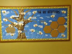 the bulletin board has been decorated with bees