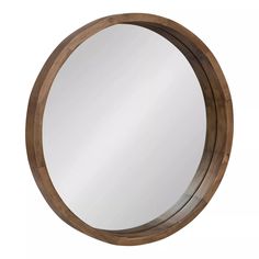 a round wooden mirror on a white background