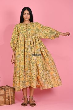 "Printed Cotton Dress, Long Women Dress, Cotton Maxi Dress, Flower Print Dress, Indian Tunic Dress, Block Printed Dress, Boho Dress, Sale Material ~ 100% Cotton gauze. Care ~ Gentle hand wash. Air dry in shade. Made ~ India OUR SIZE GUIDE Please use the following measurements and information as a guide to find the best fit for you so you can flow effortlessly in Indianavogue. MEASUREMENT PREFERENCE Size Chart in Inches:- Size S - Bust-40\" Size M - Bust-42\" Size L - Bust-44\" Size XL - Bust-46\ Flowy Floral Print Tunic Midi Dress, Yellow Bohemian Dress With Floral Print, Yellow Bohemian Boho Dress With Floral Print, Yellow Boho Dress With Floral Print For Vacation, Green Floral Print Boho Dress, Yellow Maxi Dress With Printed Motifs, Yellow Floral Cotton Maxi Dress, Spring Beach Dresses With Printed Motifs, Yellow Printed Summer Dress