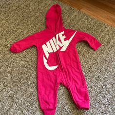 Never Worn Nike Onesie. In Excellent Condition. Willing To Negotiate Casual Pink Onesie For Winter, Casual Pink Winter Onesie, Casual Winter Pink Onesie, Casual Pink Hooded Onesie, Casual Pink Onesie For Playtime, Casual White Onesie For Sports, White Casual Onesie For Sports, Nike Cotton Onesie For Playwear, Nike Casual Onesie For Playtime