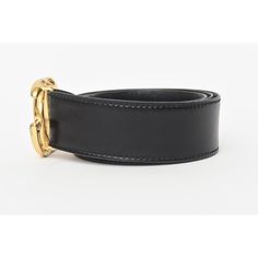 This 1980's Gucci black leather logo wide vintage belt is Italian and has the large gold plated GG's. It says 100/40 on the inside back. The GG's measure 2.5" W x 2.5" H as they are intertwined. The black belt strap is 44" L or wide x 1.85" H or deep. With the GG's logo included the entire belt width is 46.25" W or long. Says Made in Italy by Gucci. There are 3 original belt holes. Black Leather Belt Buckles With Gold-tone Hardware, Black Belt Buckles With Gold-tone Hardware For Business, Luxury Black Belt Buckles With Gold-tone Hardware, Luxury Black Belt Buckle With Gold-tone Logo Plaque, Formal Black Belt Buckles With Gold-tone Logo, Elegant Black Belt Buckle With Gold-tone Logo, Gucci Designer Belt Buckles For Business, Designer Formal Belt Buckles With Gold-tone Hardware, Designer Belt Buckles With Gold-tone Hardware For Formal Wear