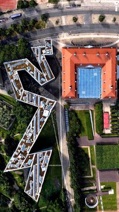 an aerial view of a parking lot with cars parked in it