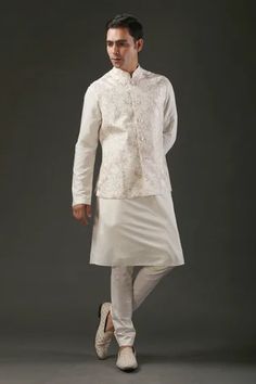 Ivory chanderi silk Nehru jacket with resham embroidery in bird and floral motifs.
Component: 1
Pattern: Embroidered
Type Of Work: Bird,Floral
Neckline: Band
Sleeve Type: Sleeveless
Fabric: Chanderi Silk, Lining: Silk 
Color: Ivory
Other Details: 
Resham work
Note: Pant and kurta worn by the model is not for sale
Occasion: Groom,Wedding - Aza Fashions Elegant White Chanderi Nehru Jacket, White Sleeveless Nehru Jacket With Resham Embroidery, Spring Wedding Nehru Jacket In Chanderi, White Chanderi Nehru Jacket With Resham Embroidery, White Bandhgala For Spring Designer Wear, Festive White Chanderi Nehru Jacket, Fitted Off White Nehru Jacket With Chikankari Embroidery, Fitted Off-white Nehru Jacket With Chikankari Embroidery, White Embroidered Sleeveless Nehru Jacket