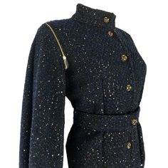 * Amazing design that can be worn 2 ways * Fitted Jacket with detachable cape style sleeves - can be worn as sleeveless jacket/vest * Beautiful black and navy woven boucle fabric with pewter colored sequins * Gold zipper details on sleeves * Fully lined * Button closure on front * Matching Waist belt with button closure Available Sizes: * Sizes: XS- XL * Sleeve Length: 25 inches * Buttons MAY vary due to availability *** Please allow up to 1 week for item to be completed. *** Fall Outerwear With Stand Collar For Evening, Fitted Evening Outerwear With Stand Collar, Fitted Outerwear With Stand Collar For Evening, Designer Winter Outerwear For Night Out, Winter Long Sleeve Outerwear With Epaulettes, Winter Outerwear With Epaulettes And Long Sleeves, Fall Workwear Outerwear With Epaulettes, Winter Workwear Outerwear With Epaulettes, Fitted Elegant Outerwear With Epaulettes