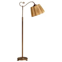 a floor lamp with a wooden shade on it