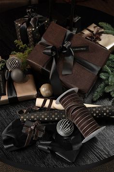 a table topped with lots of wrapped presents