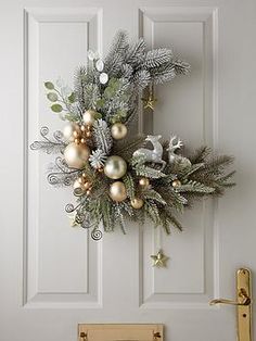 a christmas wreath hanging on the front door