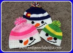 two knitted hats with snowmen on them, one has a pom - pom