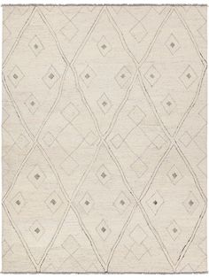 a white rug with diamond shapes on it