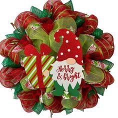 a christmas wreath with red and green decorations