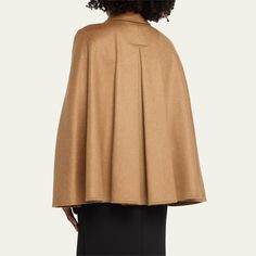 Max Mara "Obliqua" cape in virgin wool, cashmere, and leather Wing collar  Adjustable frame buckle  Hook-eye closures  Cape sleeves; buttons on cuffs  Slip pockets  Dry clean Made in Italy Brown Luxury Cashmere Outerwear, Luxury Brown Cashmere Outerwear, Elegant Wool Cape For Fall, Formal Wool Cape Outerwear, Wool Cape For Formal Occasions, Elegant Cashmere Winter Cape, Luxury Wool Cape For Winter, Luxury Wool Winter Cape, Luxury Cape For Fall