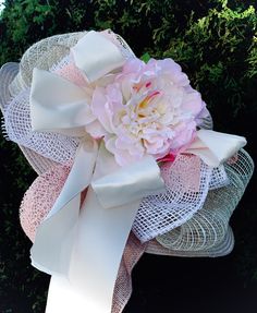 I love the soft peach color of this hat, decorated with white and cream ribbons and bows.  In the center, sits a white and soft pink peony that ties all the colors together.  Very neutral, with a soft touch of color.  Will go with many outfits!  Enjoy! 🐎 White Hat With Bow For Kentucky Derby, Spring Wedding Mini Hat With Ribbon, White Bow Hat For Kentucky Derby, Kentucky Derby Garden Party Hat With Ribbon, Ribbon Hat For Kentucky Derby Garden Party, White Flower Mini Hat For Garden Party, Feminine Hats For Garden Party, Kentucky Derby Garden Party Hat With Bow, Spring Garden Party Hat With Ribbon