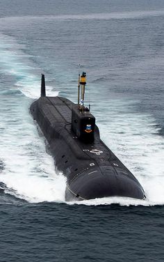 a black submarine in the middle of the ocean