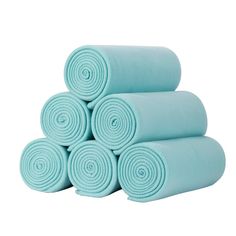 several rolled up blue towels stacked on top of each other