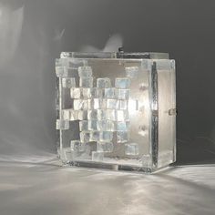 a light that is made out of ice cubes on top of a white table