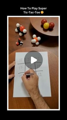 a person is drawing on a piece of paper with candies in the background and text that reads how to play super tic - tac - tac - tac - tac - toe