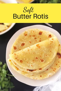 three tortillas sitting on top of a white plate next to some parsley