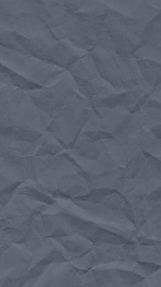 an image of crumpled paper textured in blue