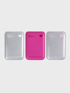 three different types of plastic cases with hearts on them, one in pink and the other in silver