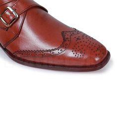 The best thing about leather shoes is that they never go out of fashion. A good quality leather shoe will last you a lifetime and fortunately for men, if you desire something from the formal range, there is a wide variety for them to choose from according to their own styling preferences. These handmade brogue shoes use premium leather in their making and are the ideal choice to sport a smart and sexy look at any formal event, either at work or at a wedding. This special rendition of dark brown wingtip leather shoes flaunts a contemporary look with a single monk strap that makes this footwear every fashion-conscious individual’s wardrobe staple. With a high-end sheen finish, these shoes further accentuate your sense of style with laser cut perforated design on the tip making them different Masculine Semi-formal Monk Strap Wingtip Shoes, Masculine Brogue Leather Shoes With Almond Toe, Masculine Leather Shoes With Brogue Detailing And Almond Toe, Masculine Monk Strap Shoes With Wingtip Leather Sole, Masculine Wingtip Monk Strap Shoes With Goodyear Welt, Bridle Leather Wingtip Oxfords With Brogue Detailing, Wingtip Oxfords With Brogue Detailing In Bridle Leather, Wingtip Bridle Leather Oxfords With Brogue Detailing, Bridle Leather Cap Toe Brogue Shoes