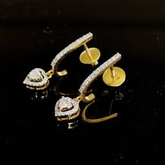 This is an exquisite pair of diamond studs set in 14K Solid Gold in a shape of a heart drops with utmost precision.  An elegant design, perfect for regular wear featuring close set sparkling diamonds. ITEM DETAILS: ✓ Gold Kt: 14K Yellow Gold ✓ Gold Weight: 3.682 grams  ✓ Diamond Shape/ Cut: Round and Heart Brilliant ✓ Diamond weight: 0.74 carats ✓ Diamond No.: 62 Natural Diamonds ✓ Diamond Color: I-J ✓ Diamond Clarity: SI ✓ Gross Weight: 3.83 grans >>The Gold purity is guaranteed and it comes wi Dazzling Hand Set Diamond Earrings For Anniversary, Hand Set White Gold Diamond Earrings For Anniversary, Anniversary Hand Set White Gold Diamond Earrings, Heart Cut Diamond Earrings With Accents For Wedding, Anniversary White Gold Hand Set Diamond Earrings, Anniversary White Gold Handcrafted Diamond Earrings, Hand Set Diamond White Diamond Earrings For Anniversary, Hand Set Diamond Earrings For Anniversary, Anniversary Diamond White Hand Set Earrings