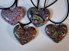 Add a touch of color to your jewelry collection with this beautiful multicolor heart polymer pendants with black wax cord or custom length chain. The heart-shaped pendants are handcrafted with love and features a unique color combinations that will complement any outfit. This pendant necklace is perfect for anyone who wants to express their personality and style. It can be personalized to make a meaningful gift for family and friends. The pendant is signed and comes with a seller warranty, ensur Adjustable Heart-shaped Multicolor Necklaces, Adjustable Heart-shaped Multicolor Necklace, Multicolor Heart Necklace For Gift, Handmade Multicolor Heart Necklace, Adjustable Multicolor Heart Pendant Necklace, Adjustable Multicolor Heart Necklace, Handmade Multicolor Heart Pendant Necklace, Heart Beads Polymer Clay Jewelry Gift, Heart Pendants