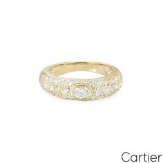 For Sale on 1stDibs - A timeless 18k yellow gold diamond ring by Cartier from the Mimi collection. The bombe style ring is set to the centre with an oval cut diamond in a bezel Classic Cartier Diamond White Diamond Ring, Classic Cartier Diamond Ring In Diamond White, Classic Cartier Diamond Ring In Yellow Gold, Elegant Oval Cartier Rings, Oval Cartier Rings For Formal Occasions, Classic Cartier Round Cut Diamond Ring, Cartier Oval Rings Fine Jewelry, Cartier Oval Fine Jewelry Rings, Classic Oval Dome Diamond Ring