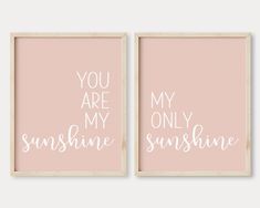 two pink and white prints with the words you are my sunshine on them