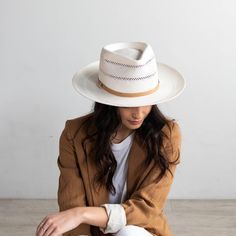 Arlo is an elevated straw fedora. Its teardrop crown + stiff upturned brim feature handwoven venting for a breezy feel + textured look. Arlo includes a hand-sewn leather band that is easily layered with other accessories. Style - Teardrop Rancher Material - Paper Straw Dimensions - Crown 11 cm Brim 8.5 cm Check out the rest of our full straw hat collection or find more wide brim straw hats! Need help with finding your hat size? See our hat sizing post here. Hats Photography, Felt Hats For Women, Rancher Hats, Gigi Pip, Women Fedora, Lifeguard Hat, Outback Hat, Hand Sewn Leather, Wide Brim Straw Hat